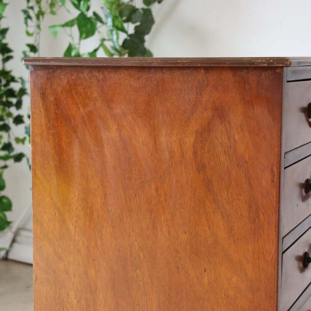 Mid-century British vintage teak record cabinet with rich wood grain, slender legs, and clean lines, from Denmark-inspired.