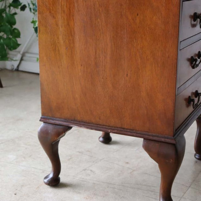 Vintage British teak record cabinet with rich wood grain, mid-century clawfoot legs, and smooth walnut finish.