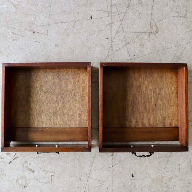 Pair of vintage British teak drawers with rich wood grain and brass handle accents, mid-century style.