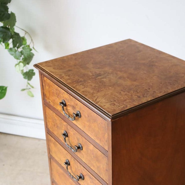 British vintage teak record cabinet with rich wood grain, mid-century style, three drawers, and brass handles.