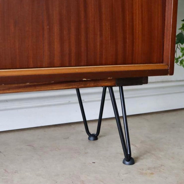 Vintage teak room divider with rich wood grain, British mid-century design, and distinctive black iron hairpin legs.