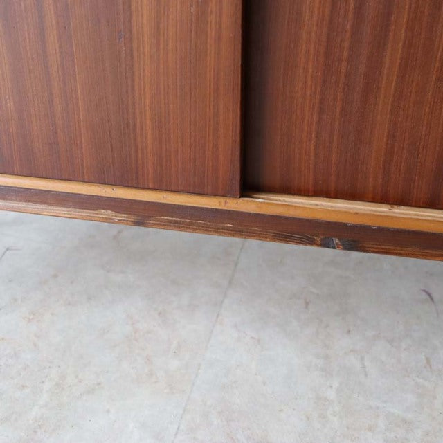 Mid-century vintage teak room divider with rich wood grain and sturdy iron legs, British-Denmark style.