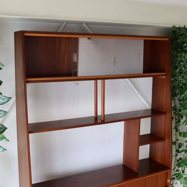 Vintage mid-century teak room divider with British-Denmark style, iron legs, open shelves, and sliding glass panel.