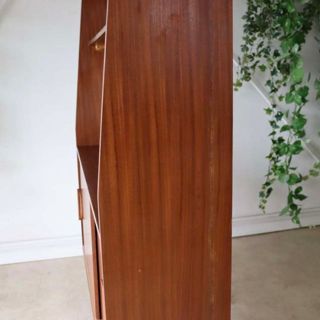 Vintage teak mid-century room divider with smooth wood grain and iron legs, British-Denmark design.