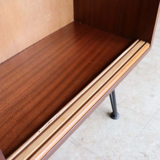 Mid-century vintage teak room divider with rich wood grain and tapered British iron legs from Denmark.