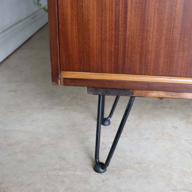 Vintage mid-century teak room divider corner with British iron hairpin legs, rich wood grain, and sturdy form.