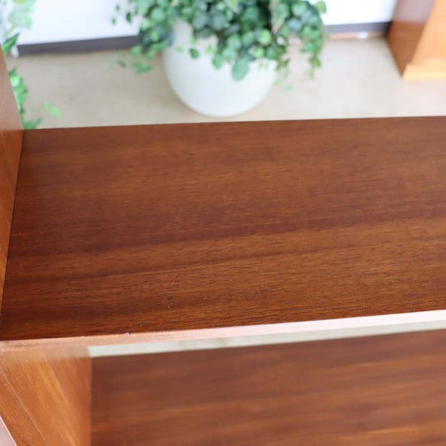 Vintage teak room divider with rich wood grain, British mid-century design, iron legs inspired by Denmark style.
