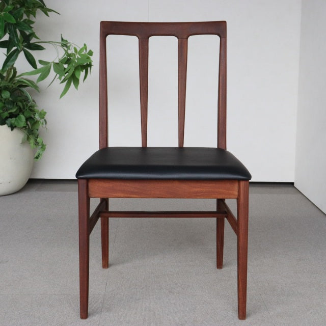 Vintage teak dining chair by Younger Fonseca with black leather seat, British mid-century design, slender tapered legs, and.