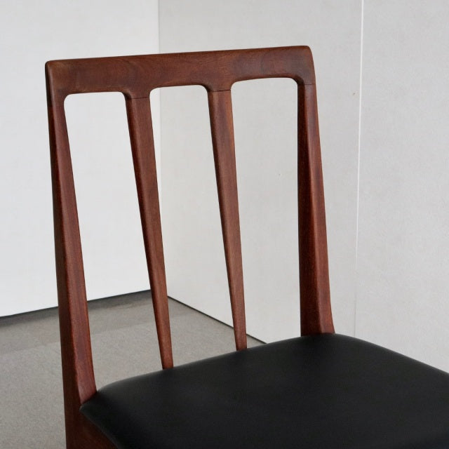 Vintage mid-century teak dining chair by Younger Fonseca with black leather seat, slender tapered legs, and minimalist.