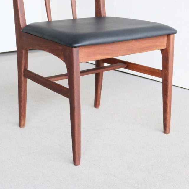 Vintage mid-century teak dining chair by Younger Fonseca with black leather seat and slender tapered legs.