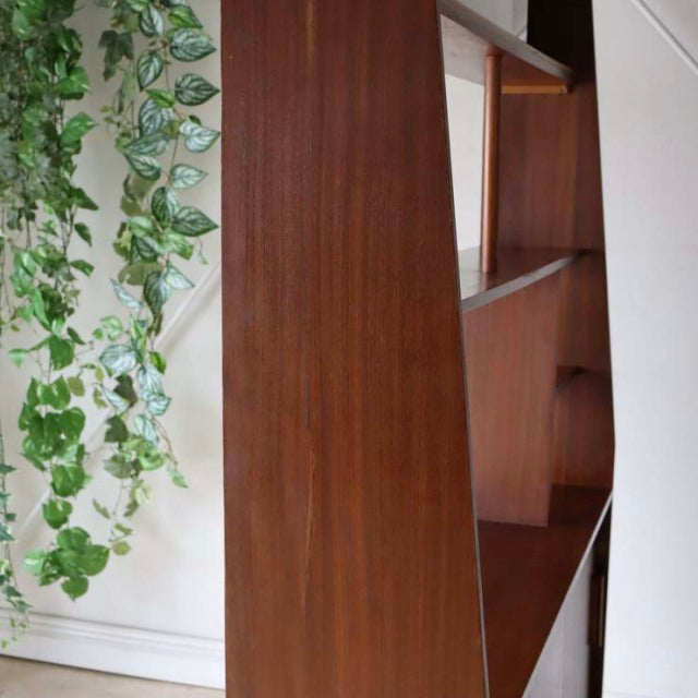 Vintage teak mid-century room divider with British design, tapered iron legs, and rich wood grain details.