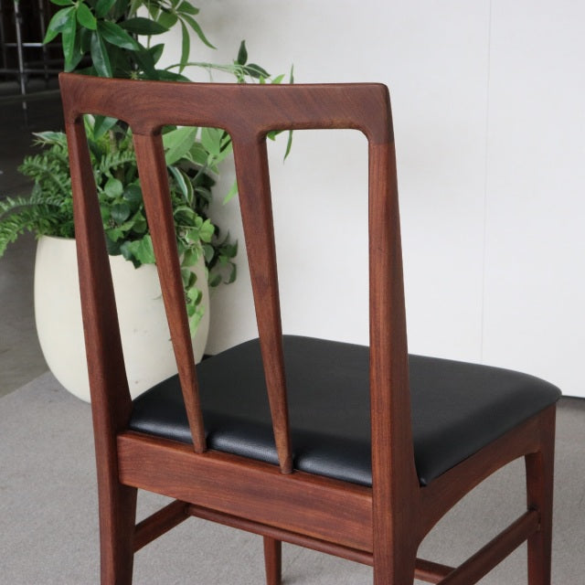 Vintage teak dining chair by Younger Fonseca, British mid-century style with black leather seat and sleek tapered legs.