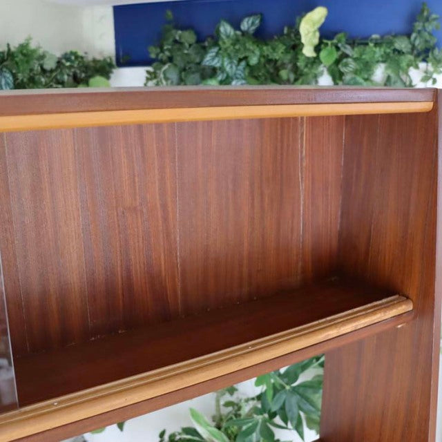 Vintage teak wood room divider with clean mid-century British design, smooth grain finish, and iron legs from Denmark style.