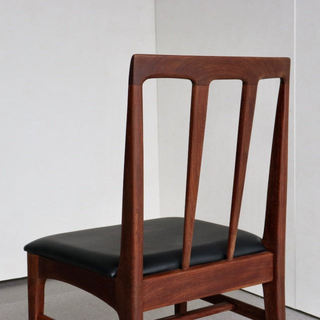 Mid-century teak dining chair by Younger Fonseca with black leather seat and clean British design lines.