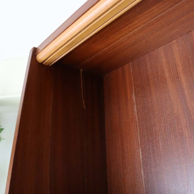 Vintage teak mid-century room divider with British design, rich wood grain, and sturdy iron legs from Denmark.