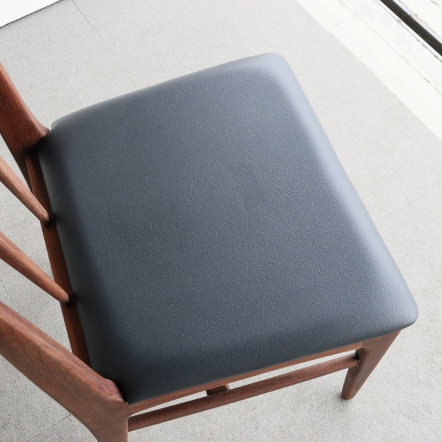Vintage teak dining chair from Younger Fonseca series with sleek black leatherette seat and mid-century British design.