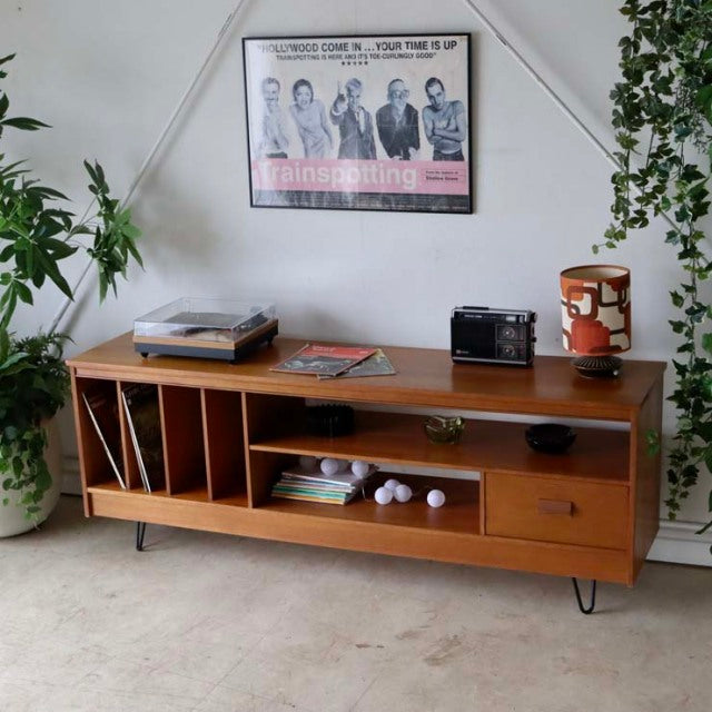 Vintage teak mid-century British TV board with open shelving, drawer, and unique iron legs from Denmark style.