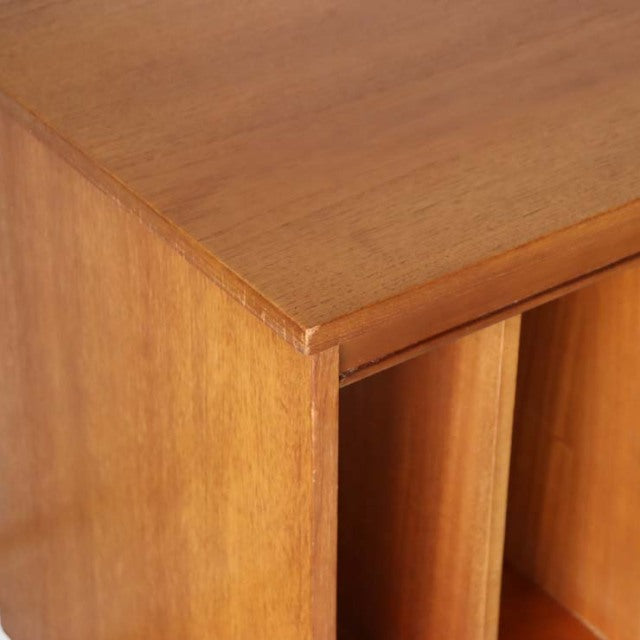 Close-up of vintage teak wood with fine grain and smooth finish, showcasing British mid-century craftsmanship and.