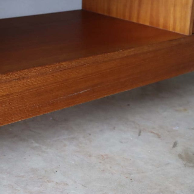 Close-up of vintage teak mid-century TV board corner showcasing rich wood grain and smooth finish.