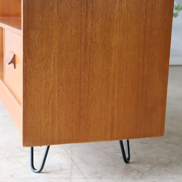 Vintage teak mid-century British TV board with smooth wood grain and slender black iron hairpin legs from Denmark style.