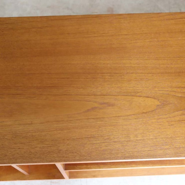 Vintage teak mid-century TV board top with smooth wood grain and warm natural finish.