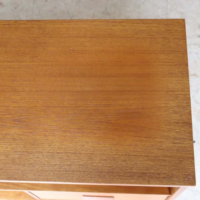 Vintage teak British mid-century TV board top showing smooth wood grain and warm brown finish.