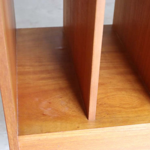 Close-up of vintage mid-century teak wood surface and interior partition of British-Denmark style TV board, showcasing.