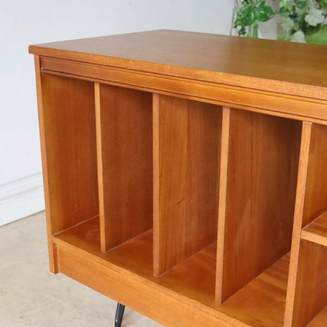 Mid-century British teak vintage TV board with natural wood grain and slim iron legs, Danish-inspired design.