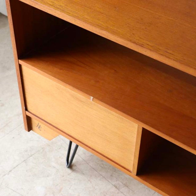 Mid-century vintage teak TV board with British design, featuring iron hairpin legs and rich wood grain.