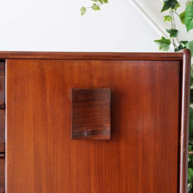 Mid-century British teak sideboard by Elliotts of Newbury with rich wood grain and square handle detail.