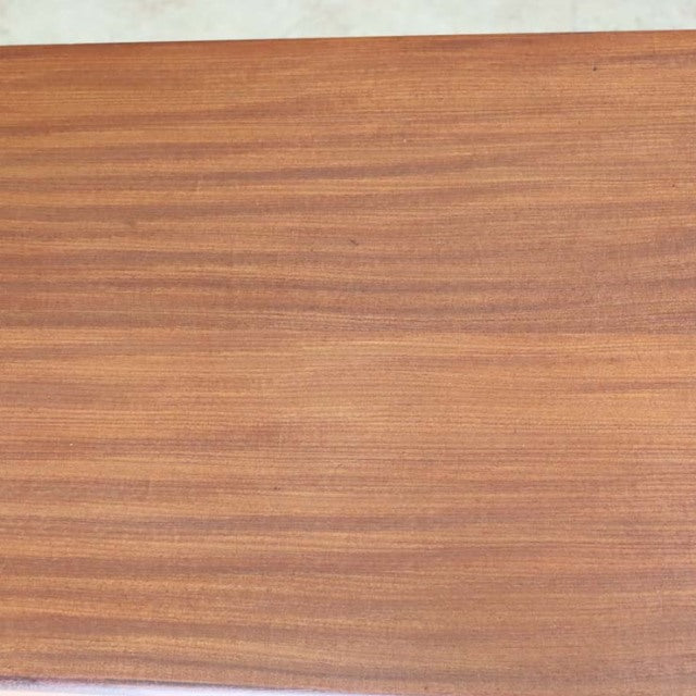 Smooth teak wood grain surface of mid-century British vintage sideboard by Elliotts of Newbury.