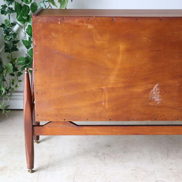 Vintage teak mid-century sideboard by Elliotts of Newbury, British craftsmanship with warm wood grain and slender tapered.