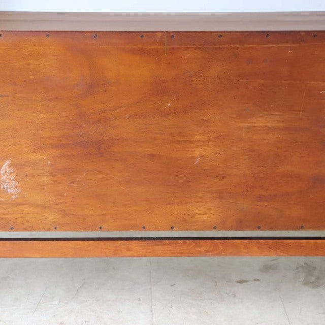 Vintage teak sideboard by Elliotts of Newbury with mid-century British design, smooth wood grain, and a floating-style base.