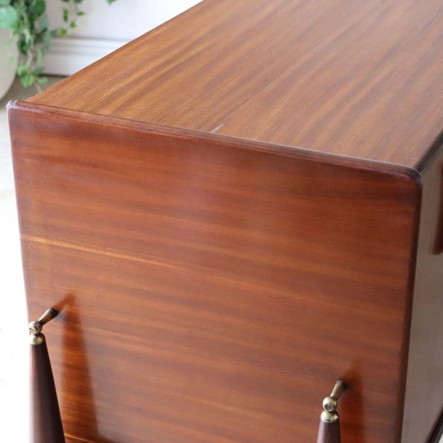 Mid-century British vintage teak sideboard by Elliotts of Newbury with smooth grain and rounded corners.