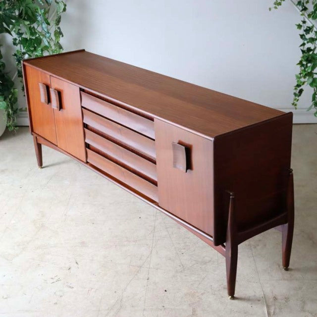 Vintage British mid-century teak sideboard by Elliotts of Newbury with Zebrano wood grain, floating style, tapered legs, and .