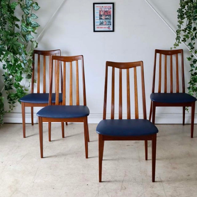 Set of four vintage Danish mid-century teak dining chairs by British G-PLAN, Fresco series, with dark navy upholstered seats .