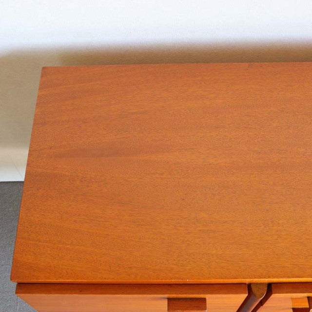 Vintage teak sideboard top with smooth wood grain, mid-century British design from Denmark.