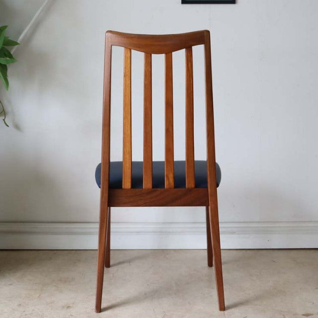 Mid-century British G-Plan Fresco dining chair in teak with vertical slatted back and navy upholstered seat.