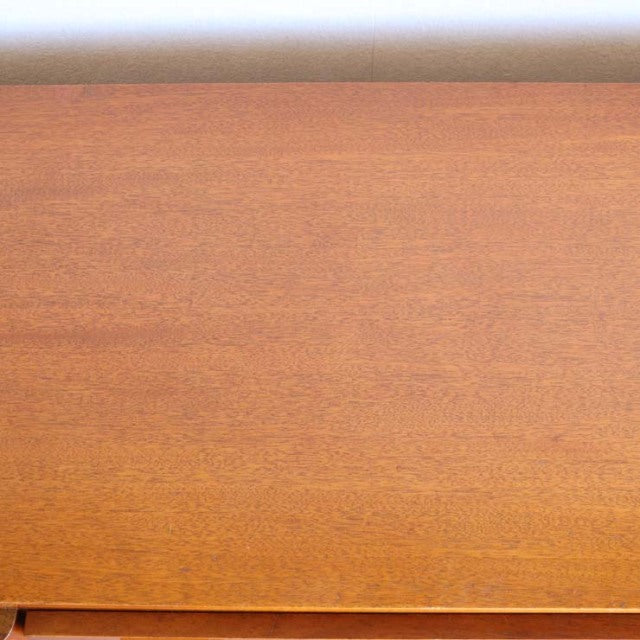 Mid-century British vintage teak sideboard top with smooth wood grain and warm honey tones.