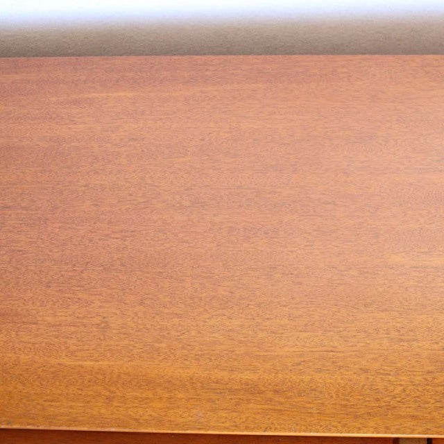 Vintage teak sideboard top showcasing smooth mid-century British craftsmanship with rich wood grain.