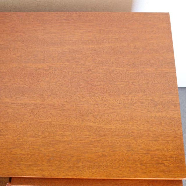 Vintage teak mid-century British sideboard top showing smooth wood grain and warm honey tones.