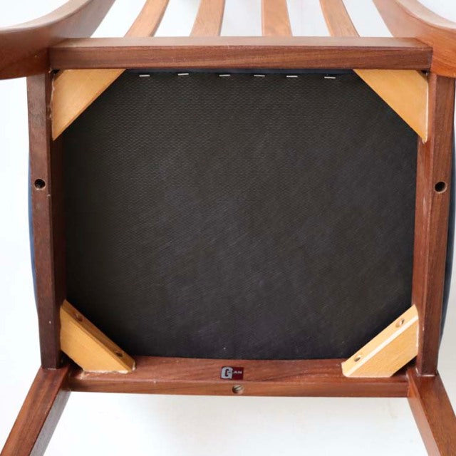 Underside of vintage British mid-century G-PLAN Fresco dining chair showing teak frame and sturdy wood grain legs with.
