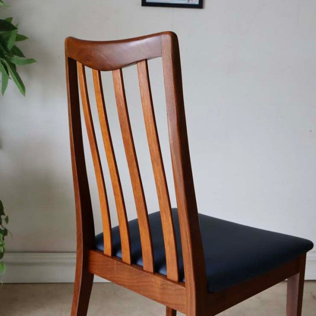 Vintage G-Plan mid-century dining chair in teak with dark navy upholstered seat and vertical slatted backrest.