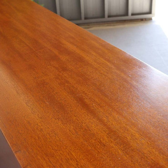 Mid-century vintage teak sideboard top showcasing warm wood grain with smooth finish, British-Denmark design influence.