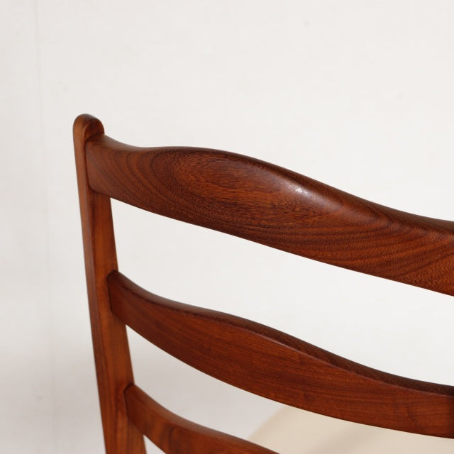 Vintage British G-PLAN teak dining chair backrest with rich wood grain and curved mid-century design from Denmark.