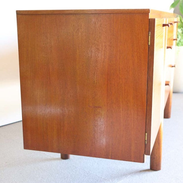 Vintage teak sideboard door panel with rich wood grain and mid-century British design, Denmark influence visible in smooth.