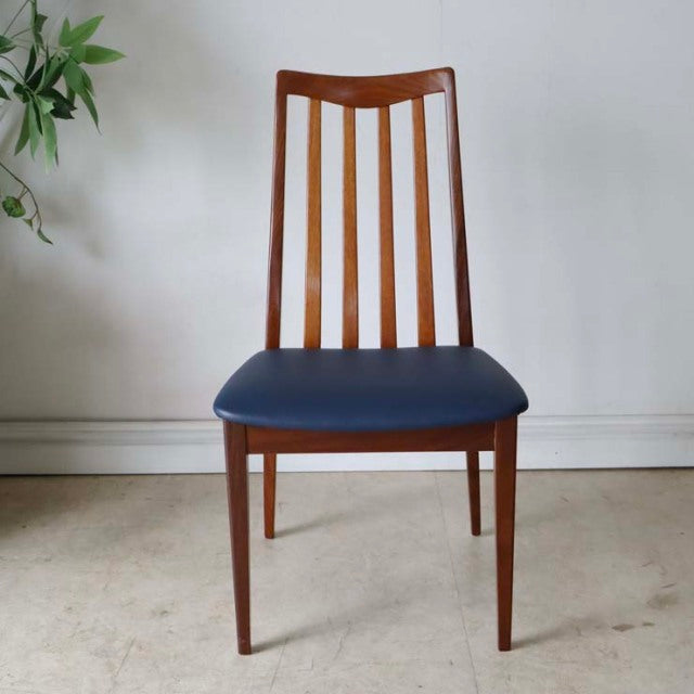 Set of four British mid-century G-PLAN Fresco dining chairs in teak with dark navy vinyl seats and slatted backs.