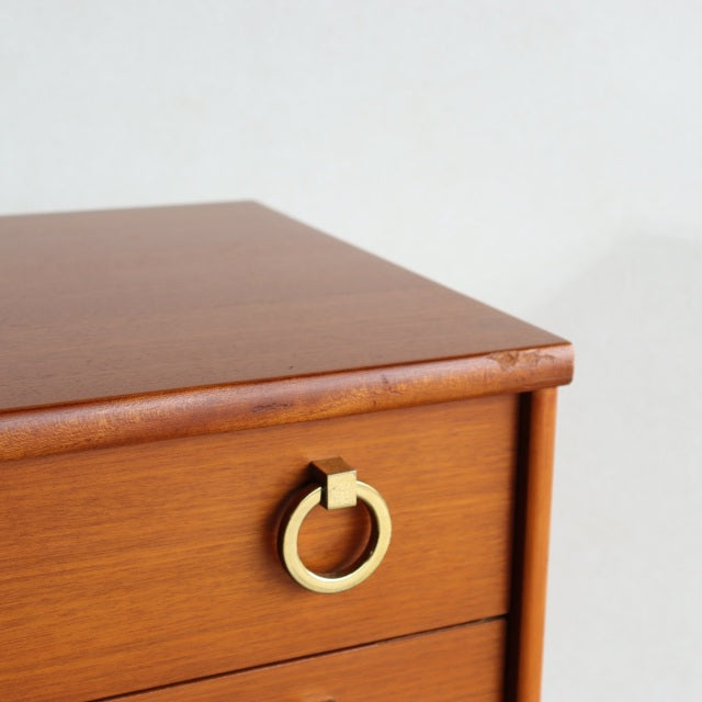 Vintage teak chest drawer by Austinsuite with smooth wood grain and mid-century British design featuring a brass ring handle.
