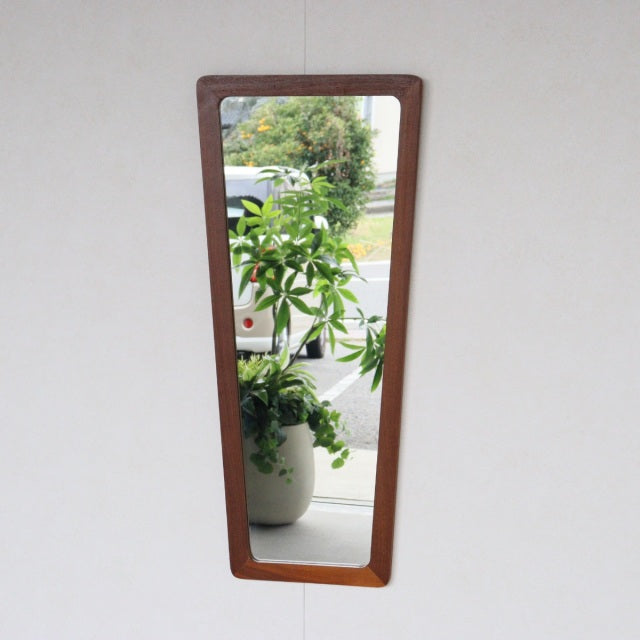 Mid-century British vintage trapezoid wall mirror with teak frame, rich wood grain, sleek minimalist design.