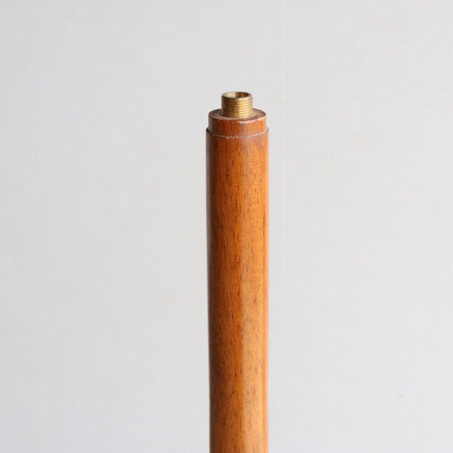 Mid-century British vintage teak floor lamp pole section with smooth wood grain and brass fitting top.